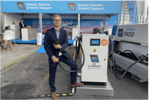 Martin Walsted poses with ITW GSE’s new DC Charger