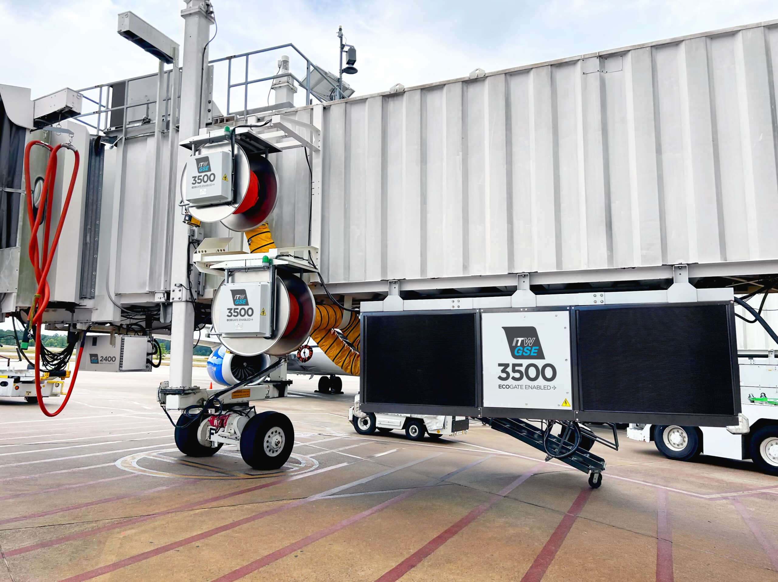 passenger boarding bridge in an airport. under the bridge is mounted a pca and a power coil