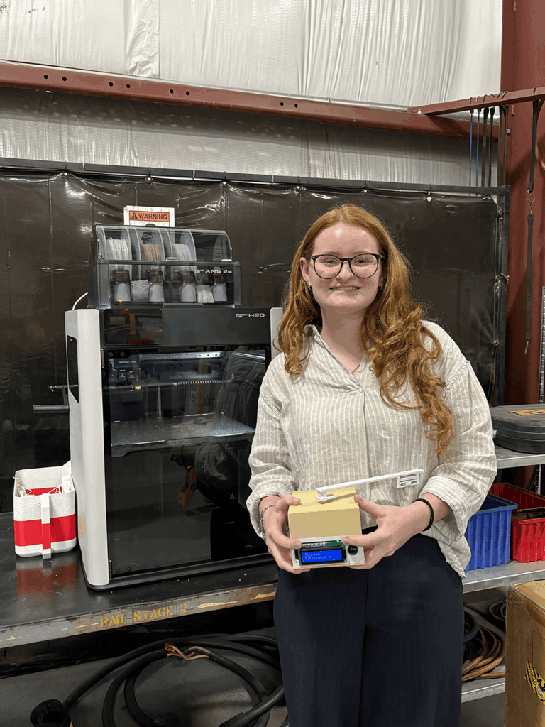 josie P showing her prototype at itw gse after her internship