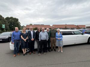 kim k p and his family and some colleagues arriving in a limosine for his 40-years work anniversary